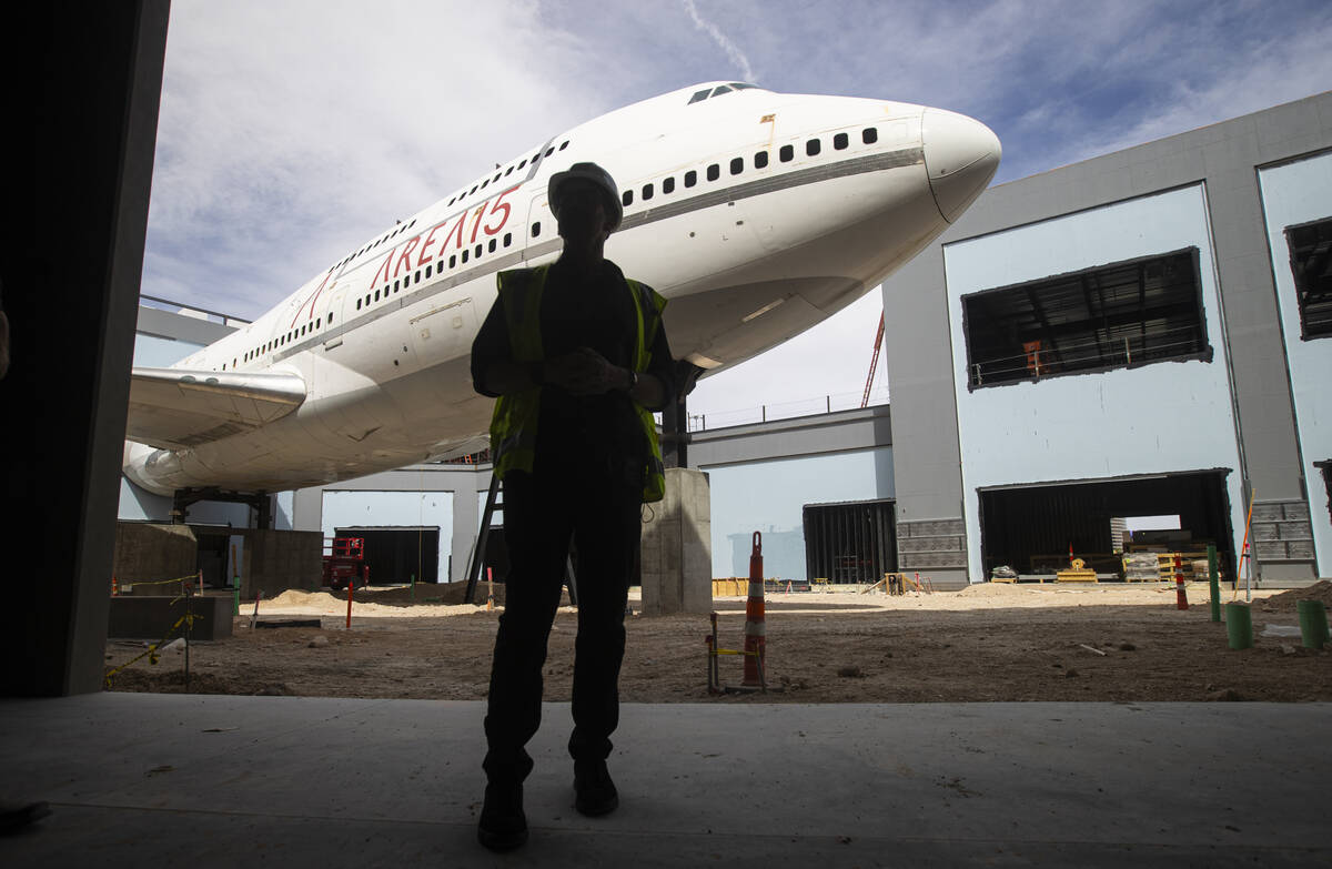 Winston FIsher, CEO of Area15, is silhouetted against a decommissioned Boeing 747 fuselage inst ...