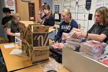 The Foothill High School Hillside Hotwire staff prepare to deliver the final issue of the news ...