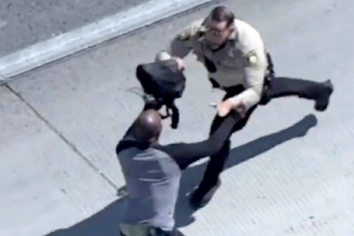 Metropolitan Police Department officers locate a man with help from the AIR2 police helicopter, ...