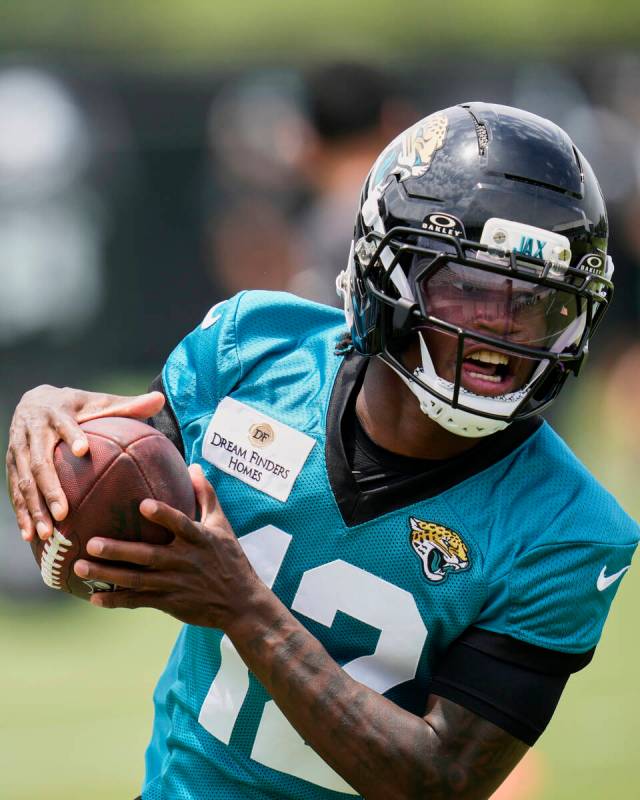 Jacksonville Jaguars wide receiver Travis Hunter makes a reception during the NFL football team ...