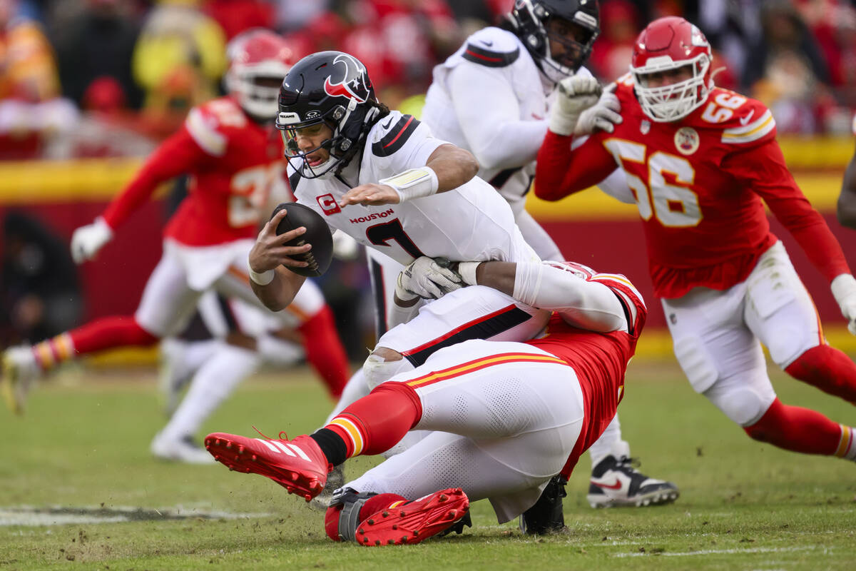Kansas City Chiefs defensive tackle Chris Jones, below, sacks Houston Texans quarterback C.J. S ...