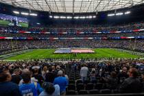 The flag is unfurled as the National Anthem is sung before the Raiders take on the Los Angeles ...