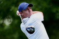 Rory McIlroy, of Northern Ireland, watches his tee shot on the second hole during a practice ro ...