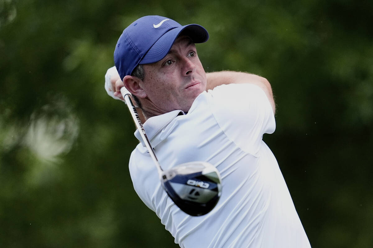 Rory McIlroy, of Northern Ireland, watches his tee shot on the second hole during a practice ro ...