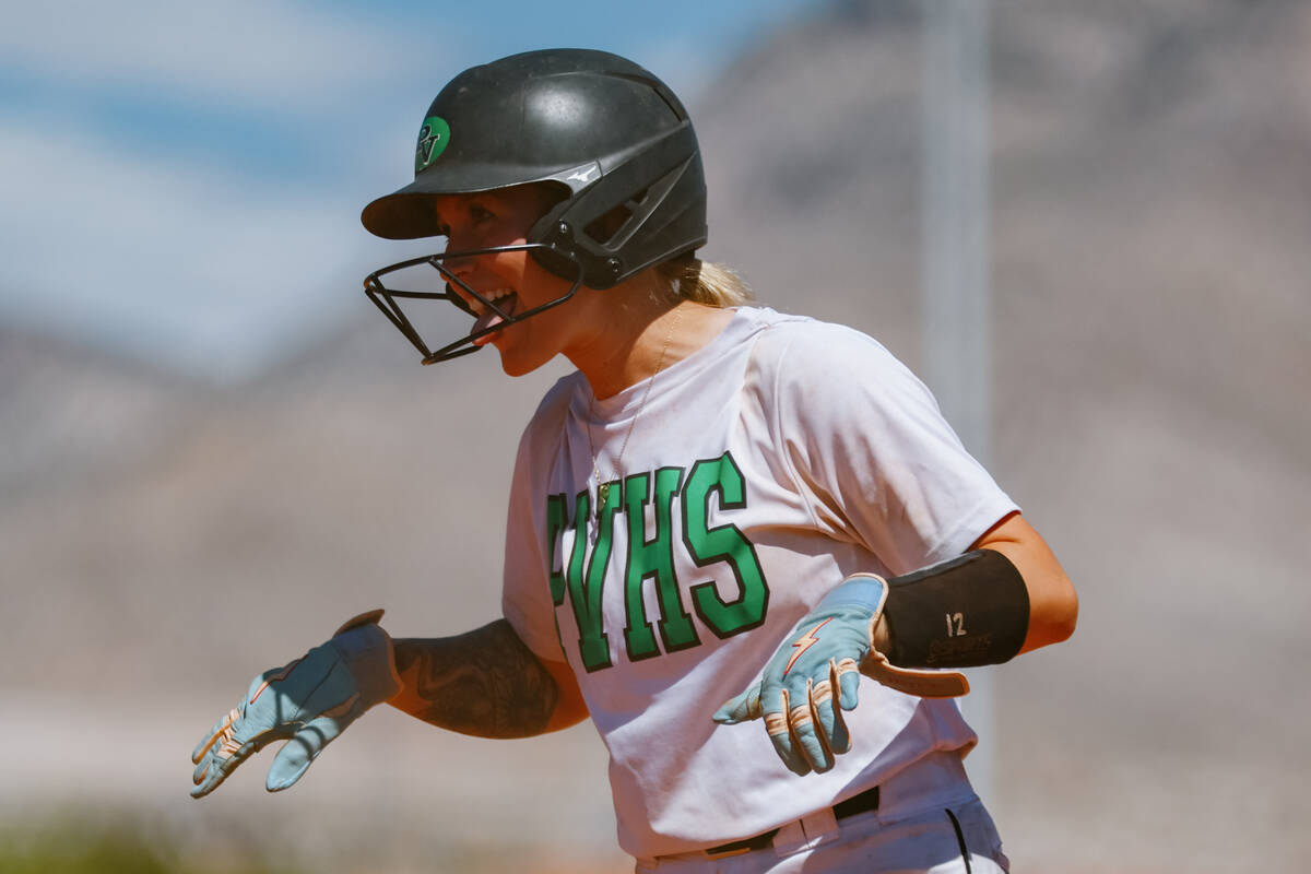 Palo Verde’s Paide Brandes (12) grins at her teammates after making it onto first base d ...
