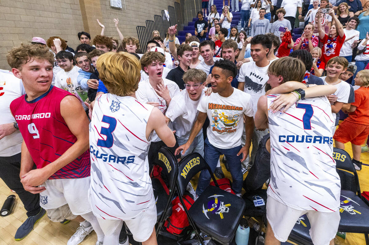 Coronado players celebrate with their fans in defeating Palo Verde to win the 5A boys volleybal ...