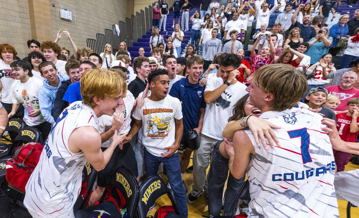 Coronado players celebrate with their fans in defeating Palo Verde to win the 5A boys volleybal ...