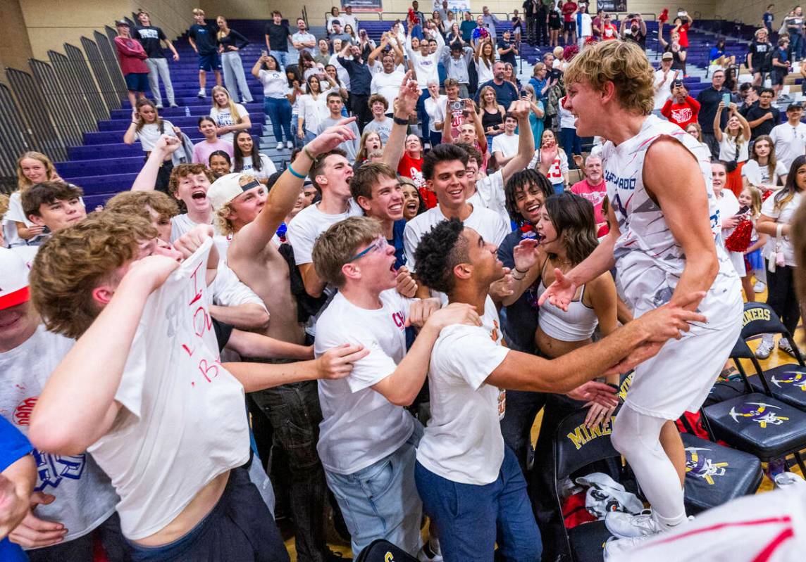 Coronado players celebrate with their fans in defeating Palo Verde to win the 5A boys volleybal ...