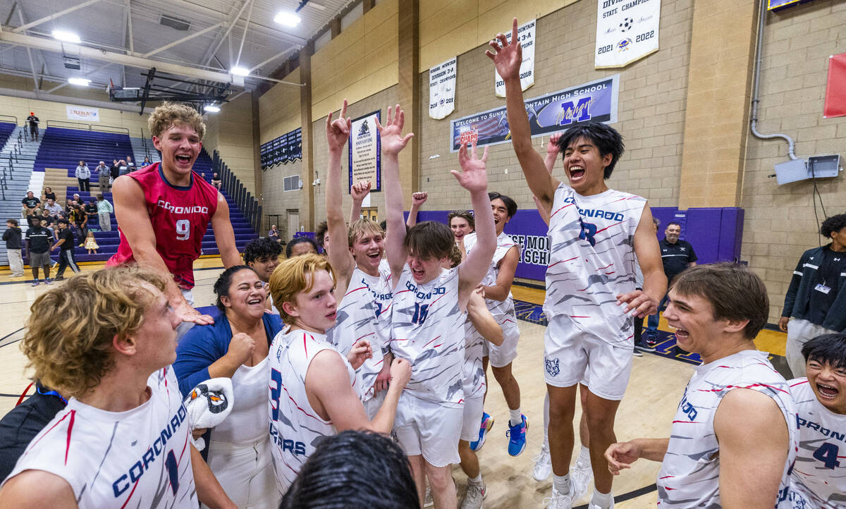 Coronado players celebrate defeating Palo Verde to win the 5A boys volleyball state championshi ...