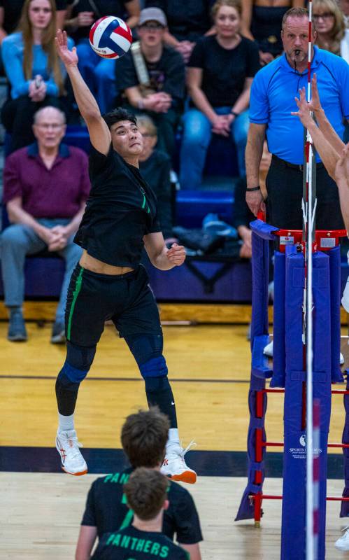 Palo Verde's Dylan Ho (11) spikes the ball back to Coronado during the 5A boys volleyball state ...