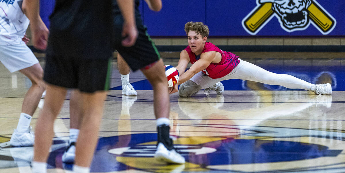 Coronado's Deacon Menlove (9) digs out a low Palo Verde serve during the 5A boys volleyball sta ...
