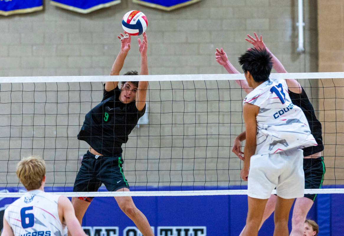 Palo Verde's Davide Bruce (9) deflects the ball spiked by Coronado's Treyden Baltazar (13) duri ...