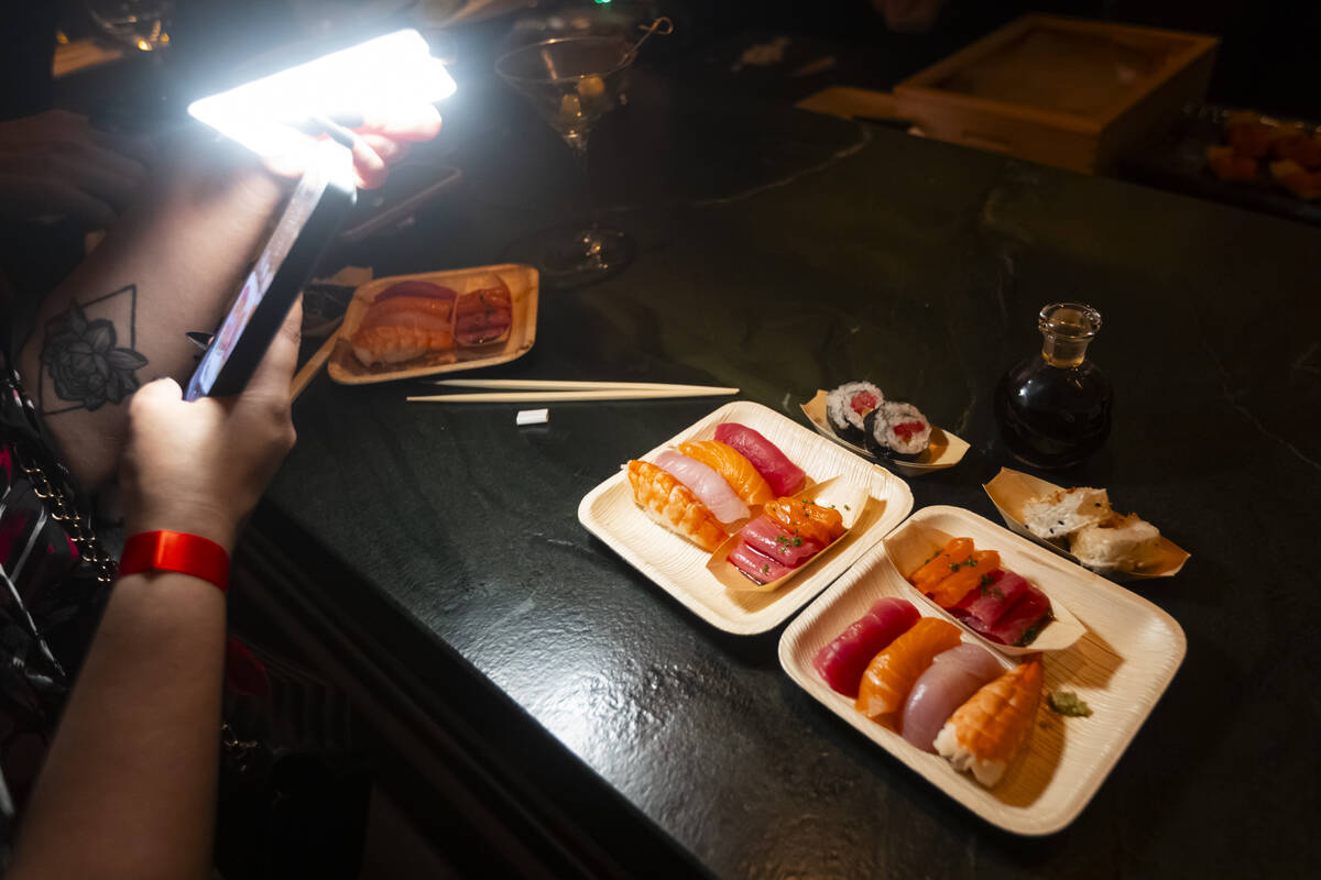 Influencer Giselle D'souza records content during the grand opening of Nomikai at The Venetian ...