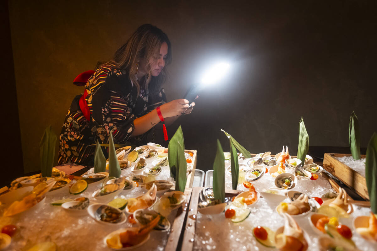 Influencer Giselle D'souza records content during the grand opening of Nomikai at The Venetian ...