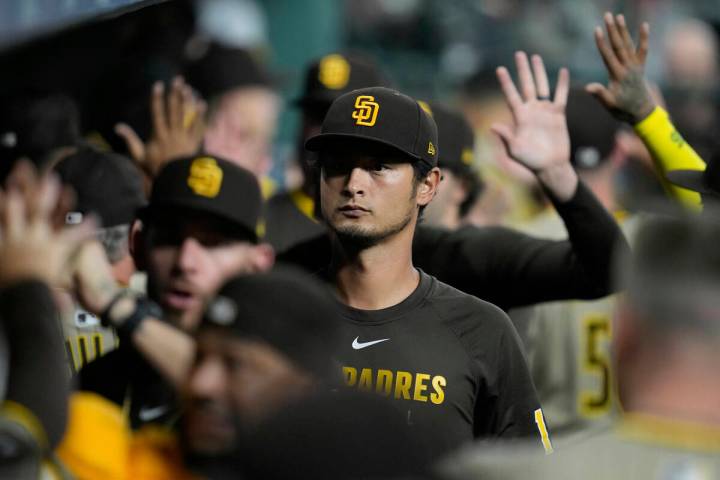 San Diego Padres' You Darvish walks through the dugout before a baseball game against the Houst ...