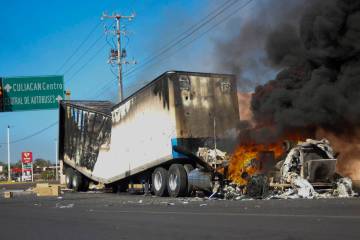 A truck burns on a street in Culiacan, Sinaloa state, Thursday, Jan. 5, 2023. (AP Photo/Martin ...
