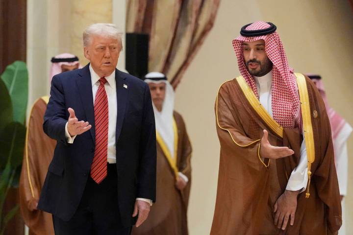 President Donald Trump arrives with Saudi Crown Prince Mohammed bin Salman for the group photo ...