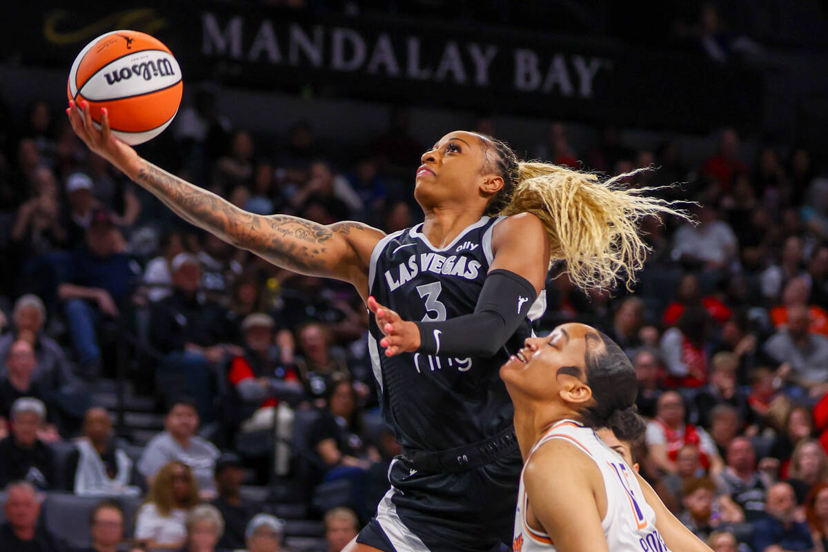 Aces guard Tiffany Mitchell (3) goes for a layup with pressure from Phoenix Mercury forward Tem ...