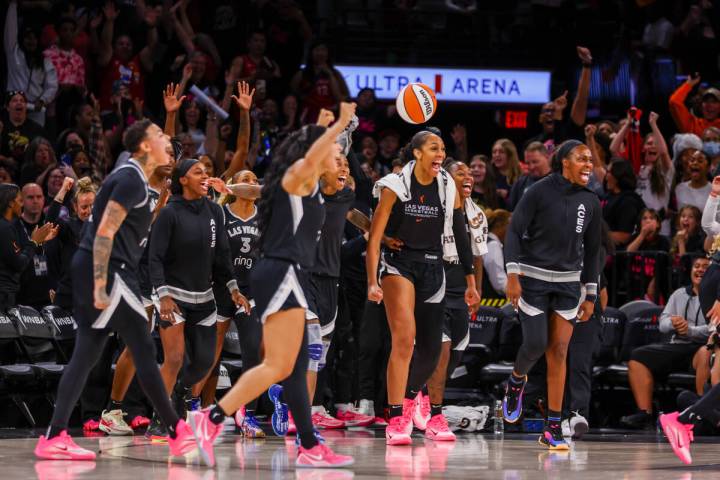 The Aces bench celebrates as the buzzer sounds, marking a win for the team in a pre-season game ...