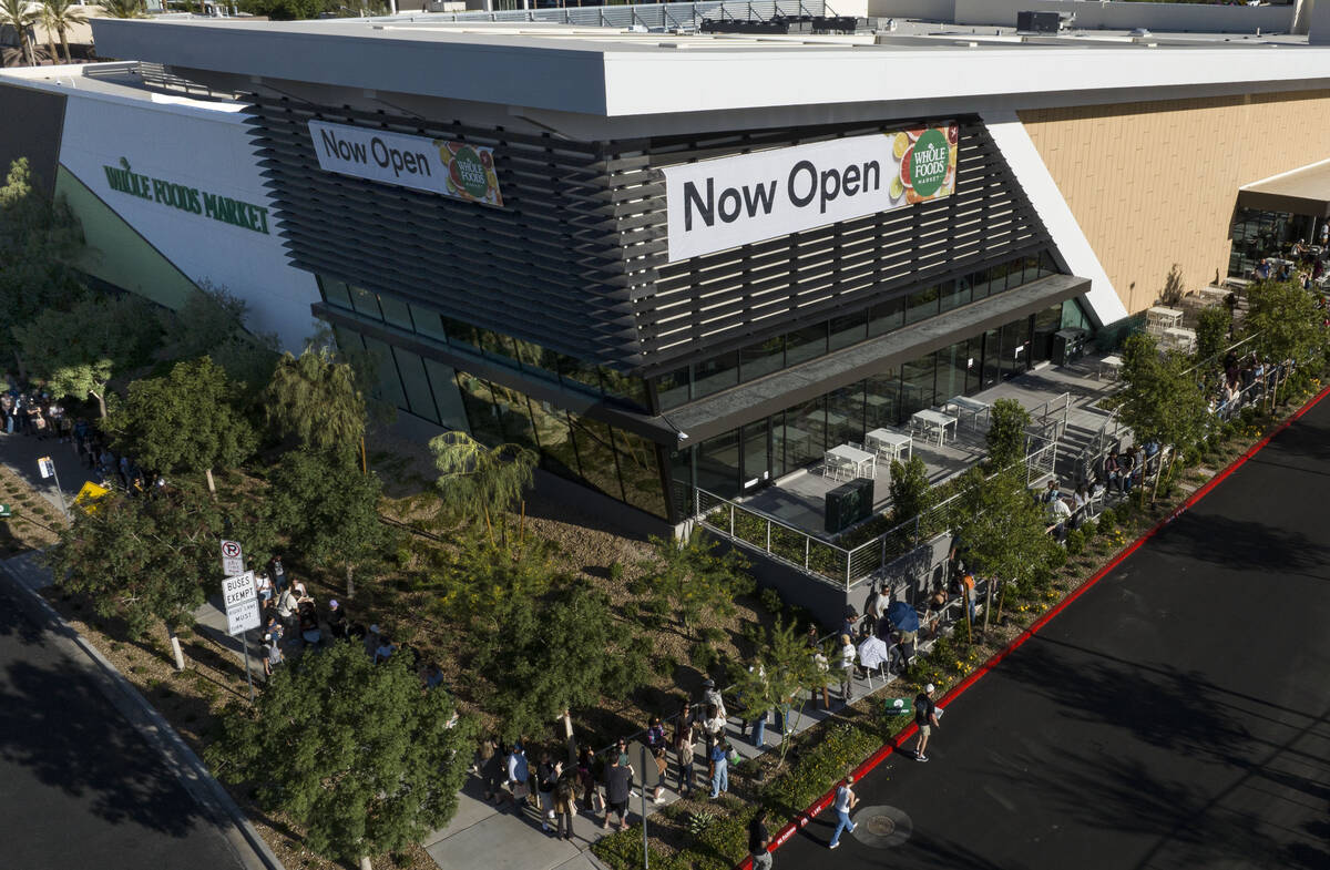 People line up outside of Summerlin Whole Foods during the grand opening of the store on Thursd ...