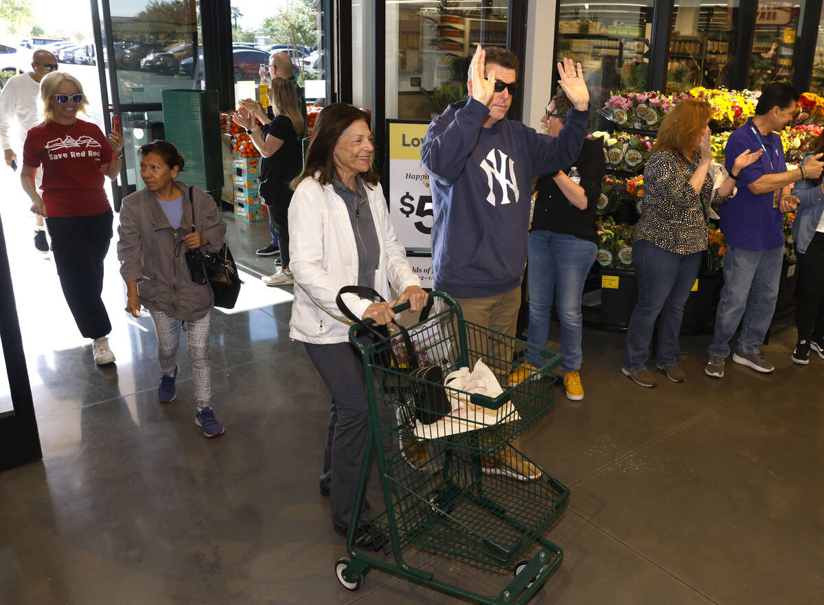 Shoppers react as they enter Summerlin Whole Foods during the grand opening of the store on Thu ...