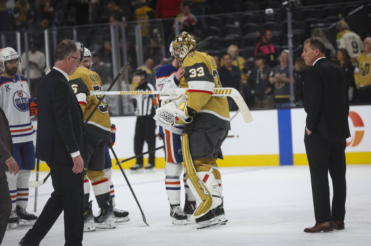 Golden Knights head coach Bruce Cassidy, right, looks on as players shake hands with the Edmont ...