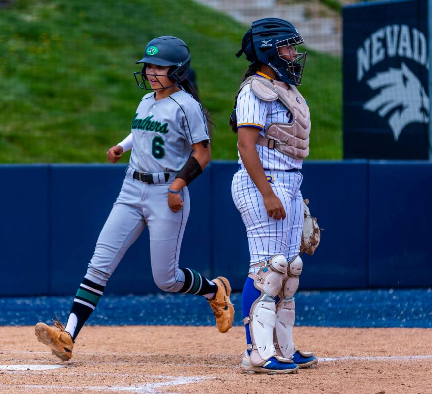 Palo Verde runner Kayleen Enriquez (6) scores as Reed catcher Krystyn Noble (21) looks to the a ...