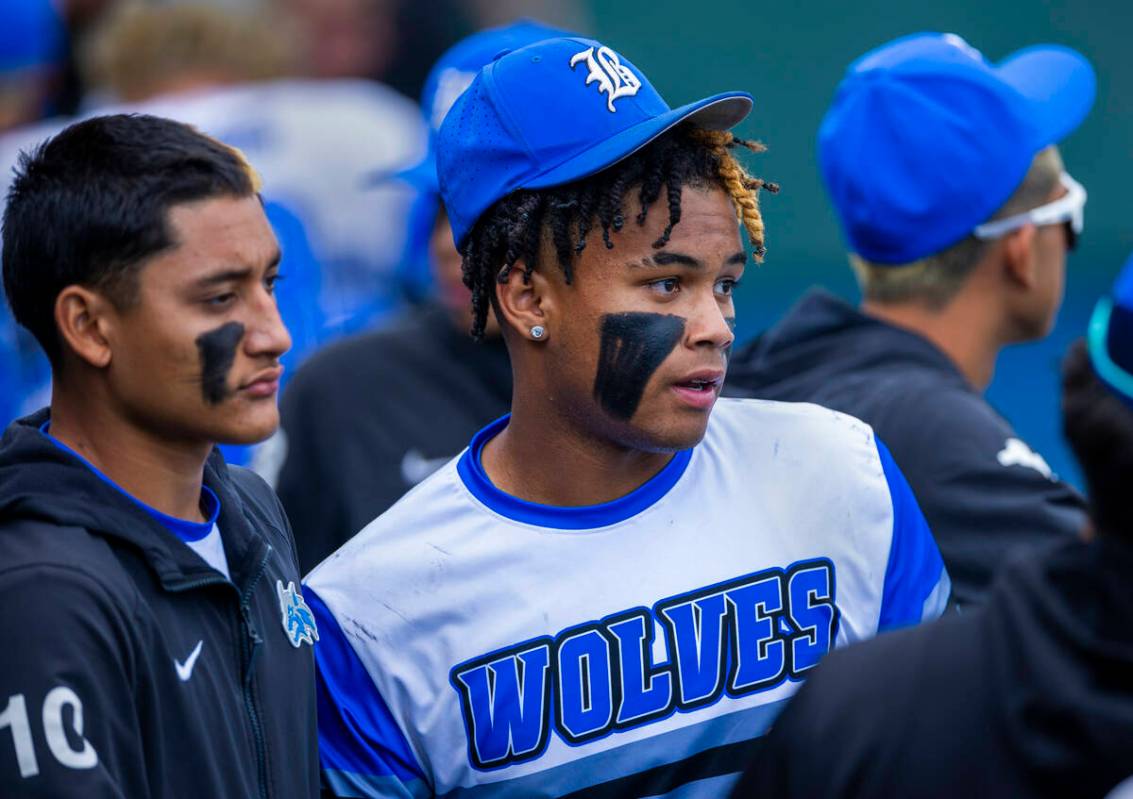 Basic infielder Gabe McDowell (25) watches the action with teammates in the dugout against Reno ...