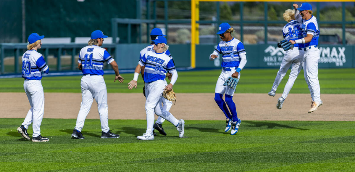Basic players celebrate their win against Reno during day one of the 5A baseball state tourname ...