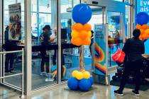 Shoppers enter and exit the Aldi discount grocery store at 7150 S. Rainbow Blvd. during its gra ...