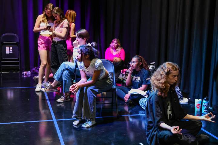 Students from Del Sol Academy sit through a rehearsal for their performance of “Mean Girls” ...