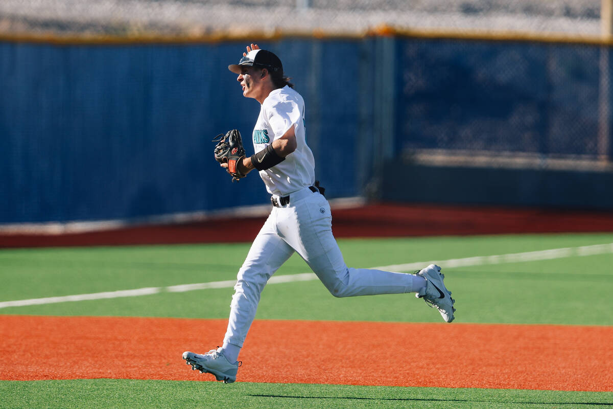 Durango outfielder Chris Turner celebrates while running back to the dugout after Durango strik ...