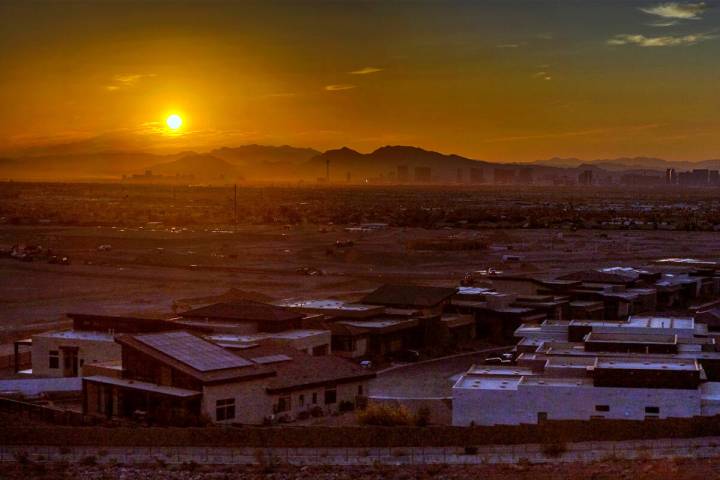 The sun rises over the valley and Strip on another high-temperature day on July 20, 2023, in L ...