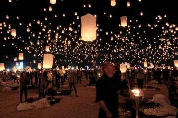 Paper lanterns are released and float to the sky at the RiSE Festival Saturday, Oct. 18, 2014, ...