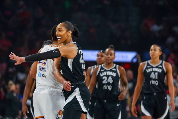 Aces center A’ja Wilson (22) greets members of the Phoenix Mercury before a pre-season g ...