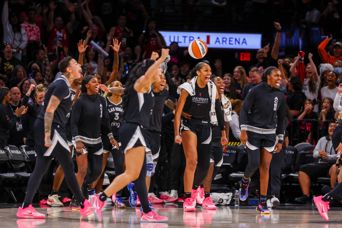 The Aces bench celebrates as the buzzer sounds, marking a win for the team in a pre-season game ...