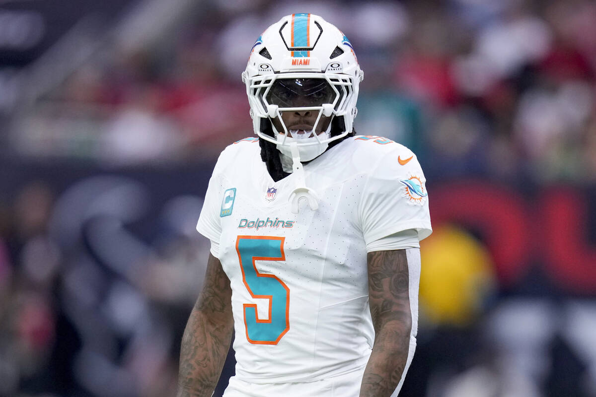 Miami Dolphins cornerback Jalen Ramsey walks on the field during the first half of an NFL footb ...