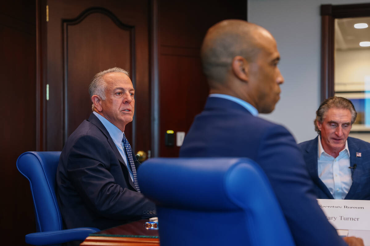 Gov. Joe Lombardo, left, meets with Interior Secretary Doug Burgum, right, and Housing and Urba ...