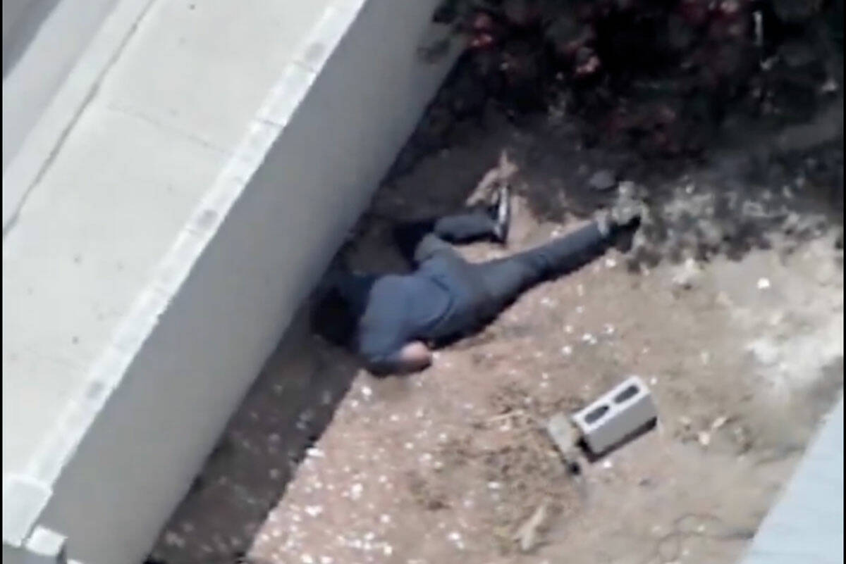 A man runs away from Las Vegas police officers after a high speed chase on Tuesday, May 13, 202 ...