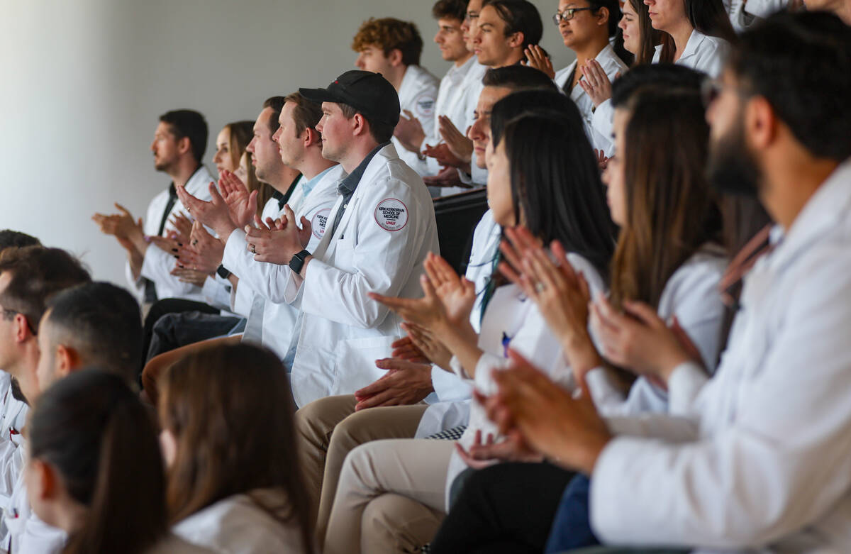 Students clap as Dr. Nehal S. Naik, out of frame, talks about the Nevada Healthcare Access Act ...