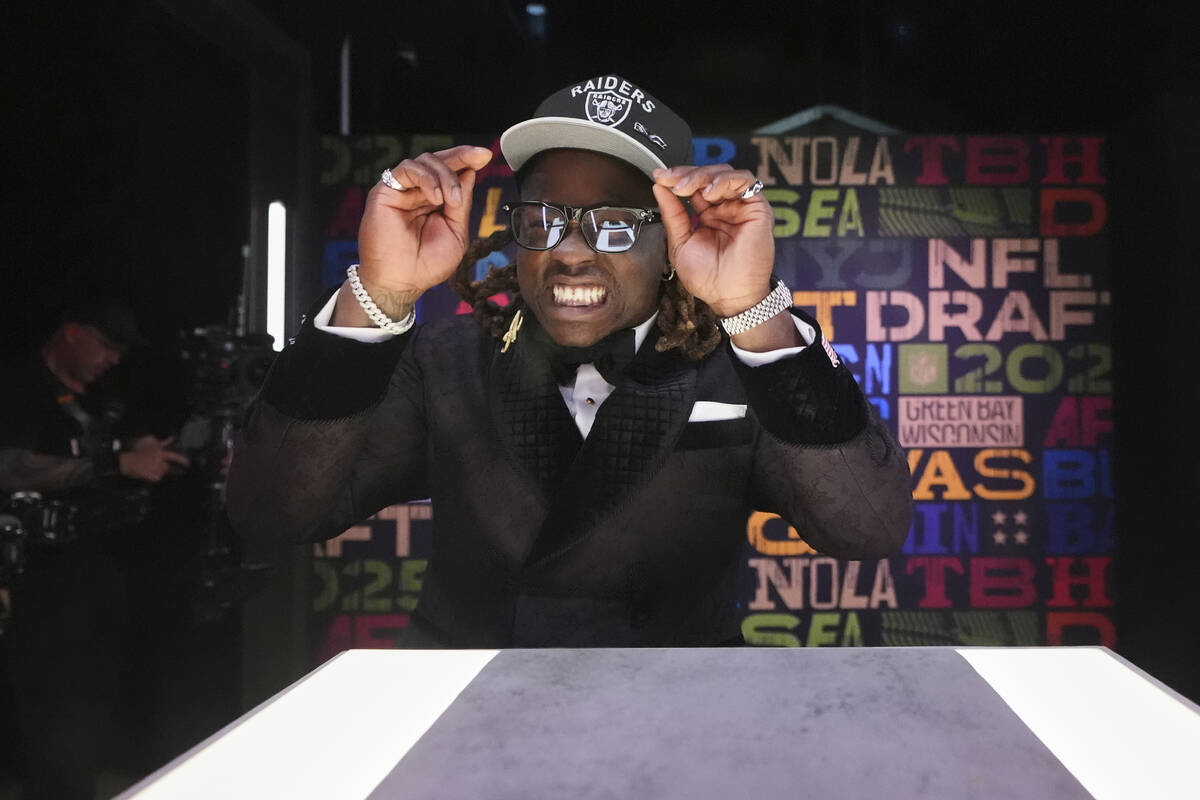 Boise State running back Ashton Jeanty puts on a hat after being chosen by the Las Vegas Raider ...