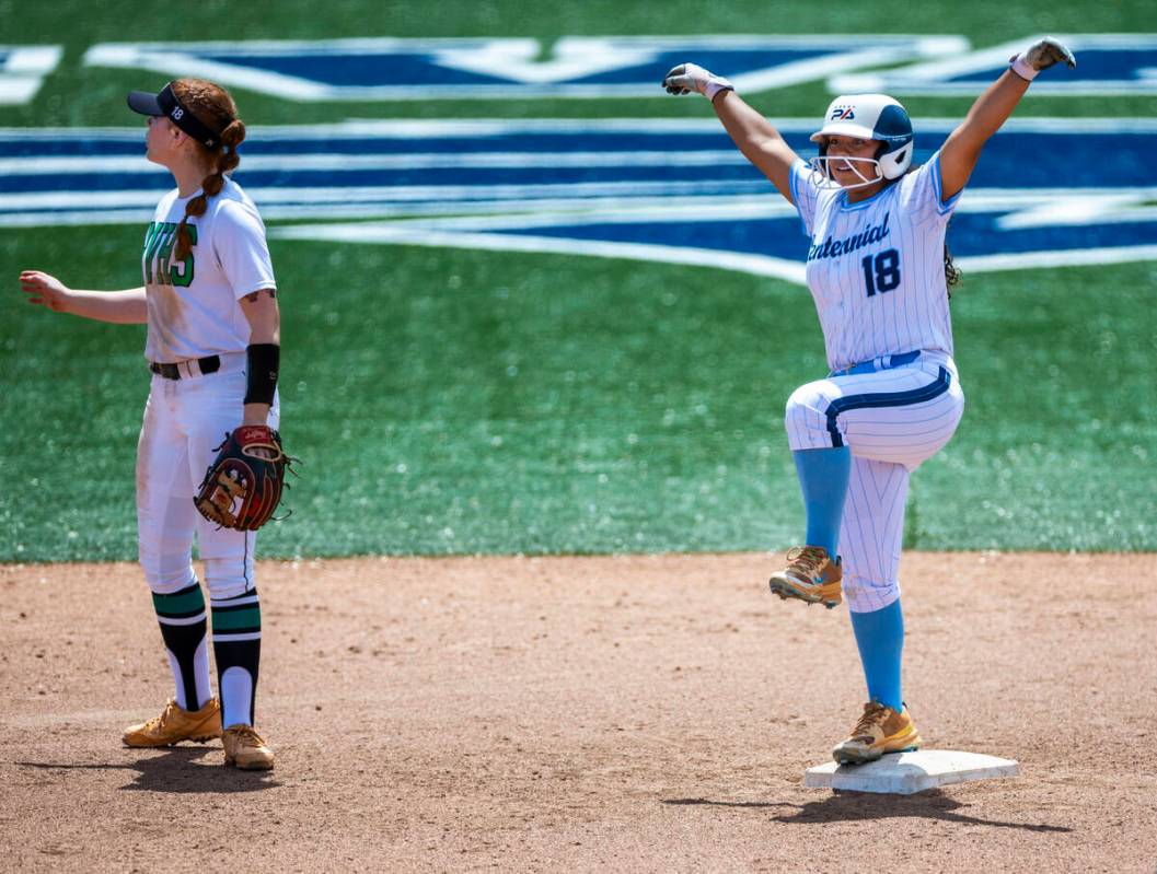 Centennial runner Abby Estrada (18) celebrates a batted double as Palo Verde infielder Mya Bar ...