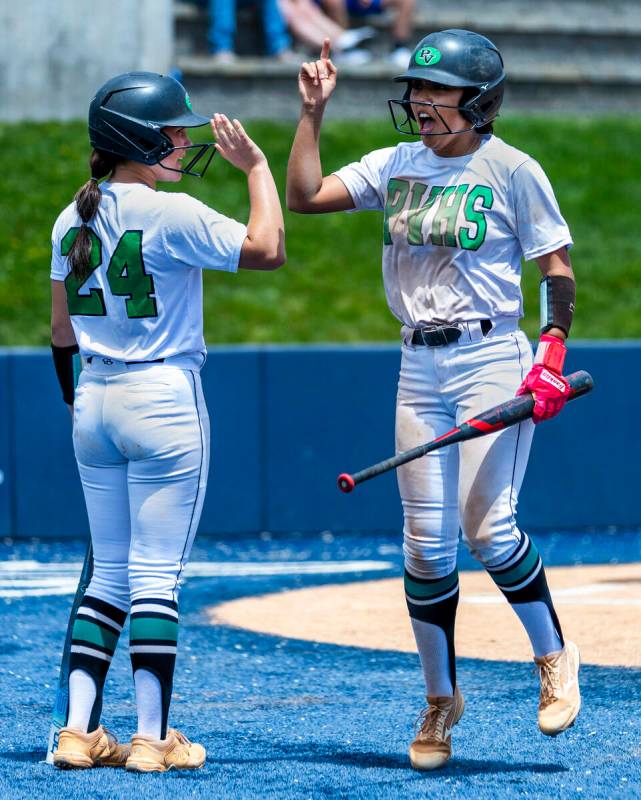 Palo Verde runner Makayla Enriquez (17) celebrates a score with teammate Ava Koenig (24) agains ...