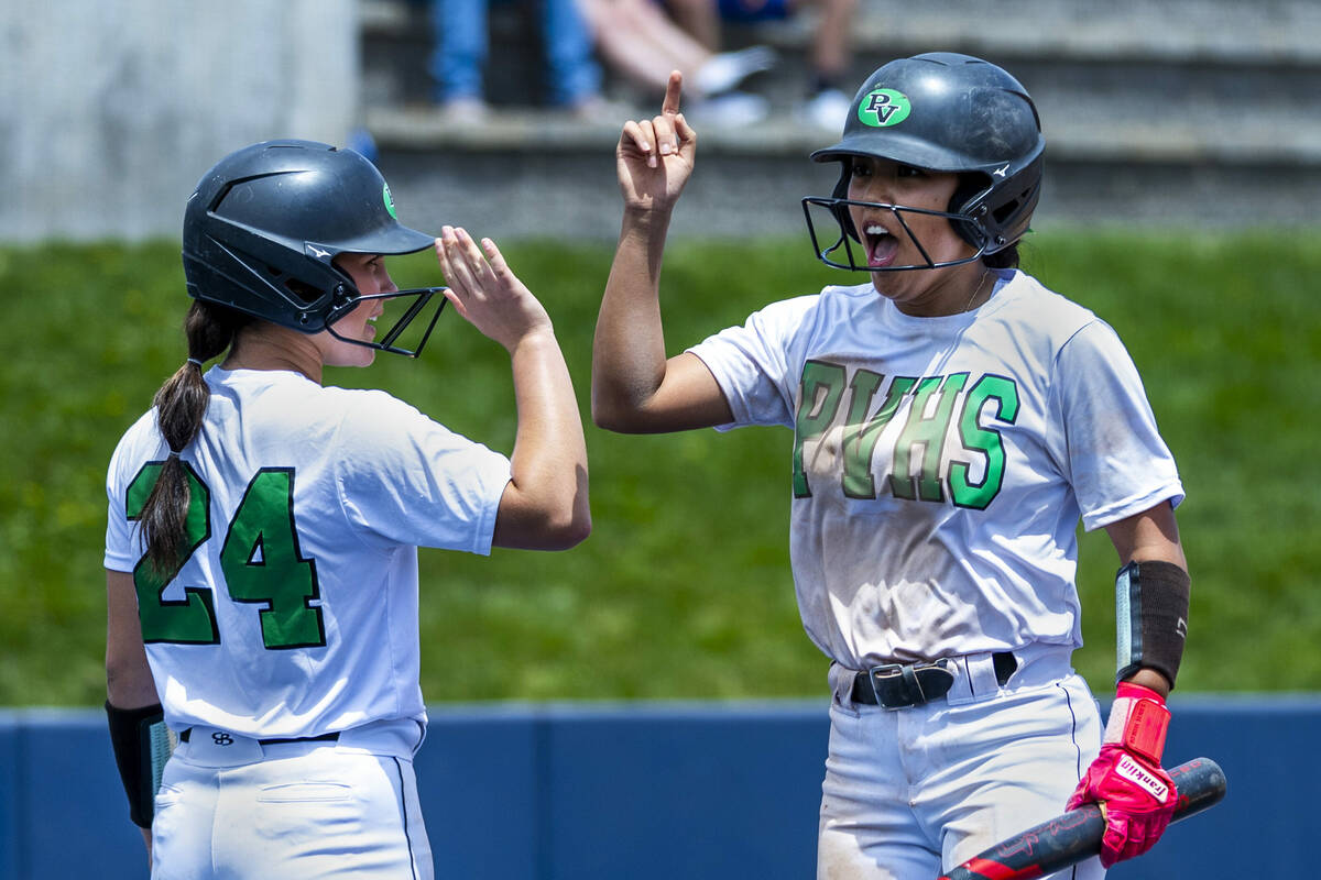 Palo Verde runner Makayla Enriquez (17) celebrates a score with teammate Ava Koenig (24) agains ...