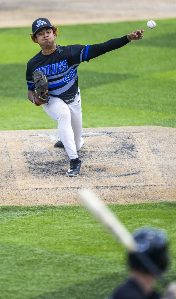 Basic pitcher Elian Ruiz (40) releases another throw to home and a Faith Lutheran batter during ...