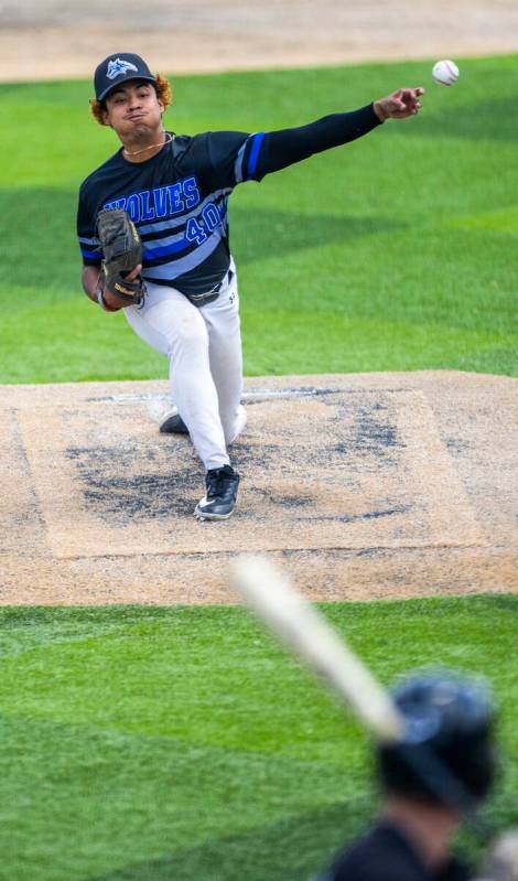 Basic pitcher Elian Ruiz (40) releases another throw to home and a Faith Lutheran batter during ...