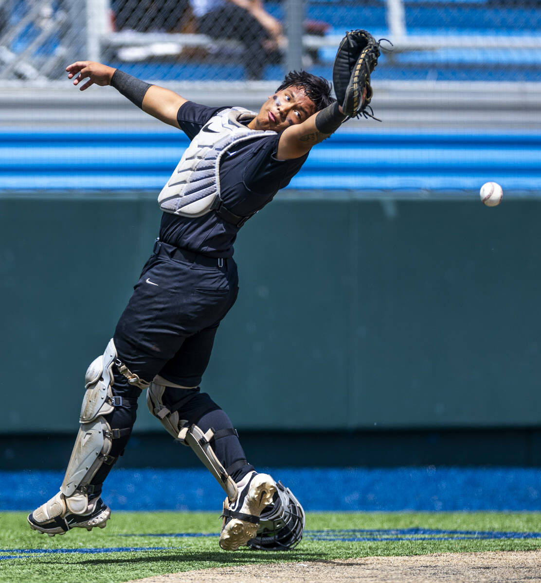 Faith Lutheran catcher Kade Gerboc-Chun (4) attempts to catch a foul fly ball against Basic dur ...