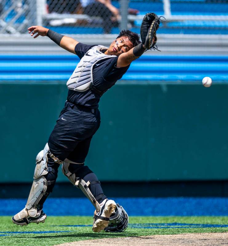 Faith Lutheran catcher Kade Gerboc-Chun (4) attempts to catch a foul fly ball against Basic dur ...