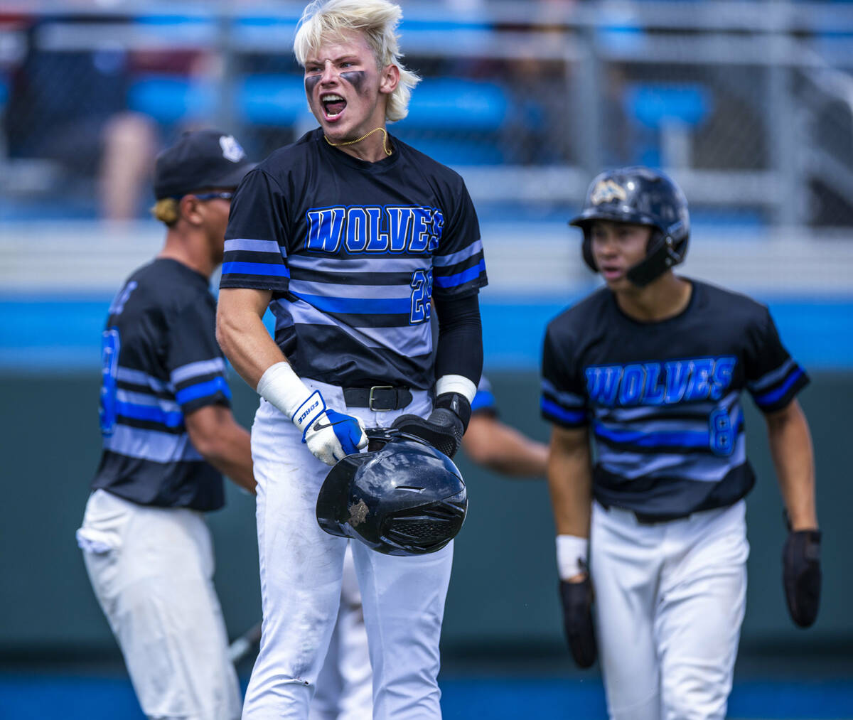 Basic runner Andruw Giles (29) celebrates a score against Faith Lutheran catcher Kade Gerboc-Ch ...