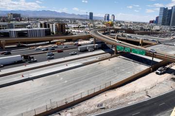 Construction crews work on Interstate 15 at Tropicana Avenue in Las Vegas Tuesday, April 29, 20 ...
